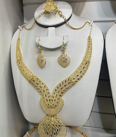 مجوهرات منى ذ - دبي - +971 6 742 9856